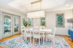 Formal dining space is open to the adjacent kitchen and living